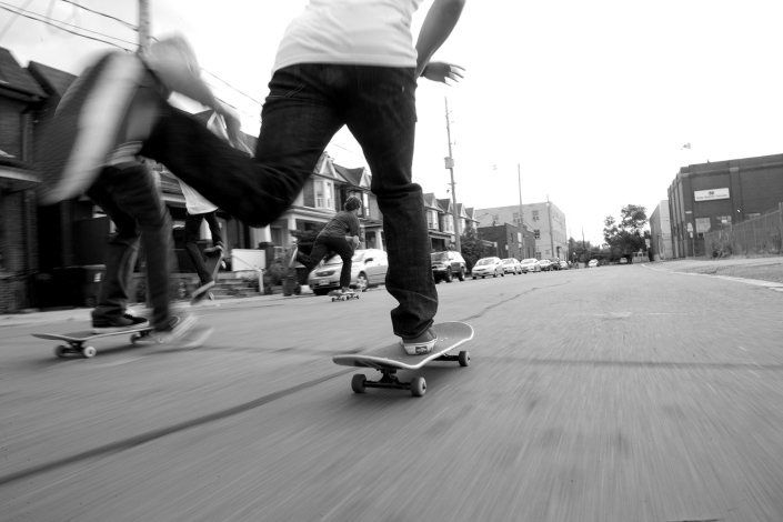 Lifestyle skateboard photography - skateboarders pushing down street - Copyright Harry Gils