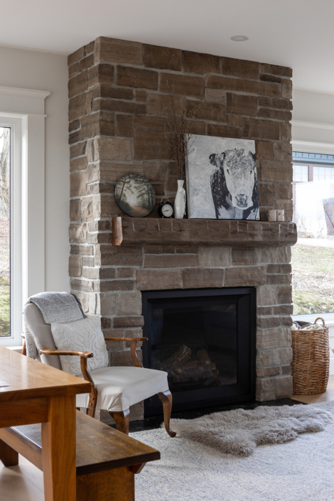Home interior photography of cozy fireplace mantle in renovated farm house
